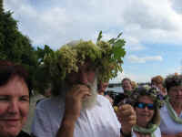 Tom & Cynthia looking fetching in their floral headgear